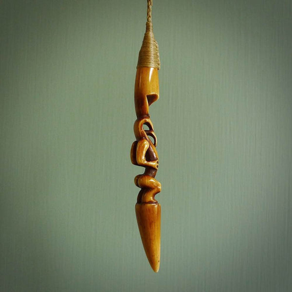 HAKA - a traditional Māori tiki pendant, hand carved for us by Yuri Terenyi. This is a work of art and is a collectable piece of traditional bone carving. It can be worn as a special piece of jewellery or displayed. This is art made to wear at its finest.