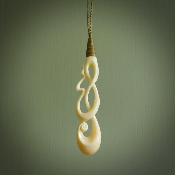 A wonderful, intricate pendant handcarved by Yuri in bone. A beautifully sensual and fascinating form that reflects the complexity and wonder of human relationships.