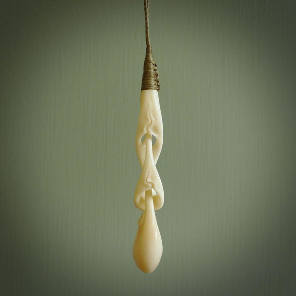 A wonderful, intricate pendant handcarved by Yuri in bone. A beautifully sensual and fascinating form that reflects the complexity and wonder of human relationships.