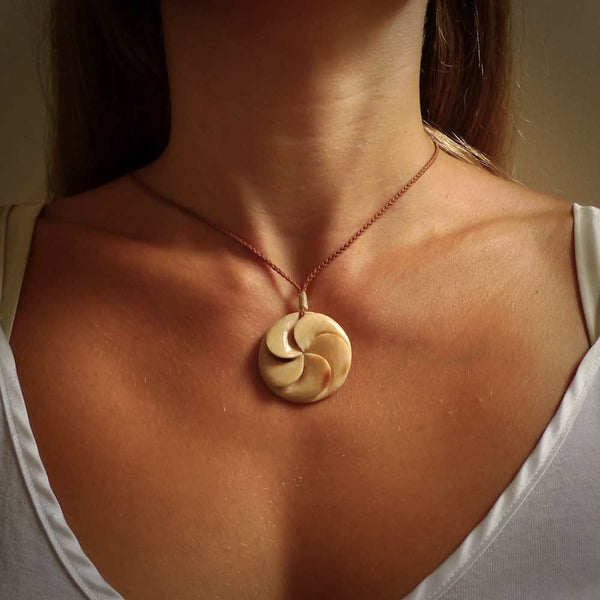 Hand carved koru style pendant. Made from Woolly Mammoth Tusk.