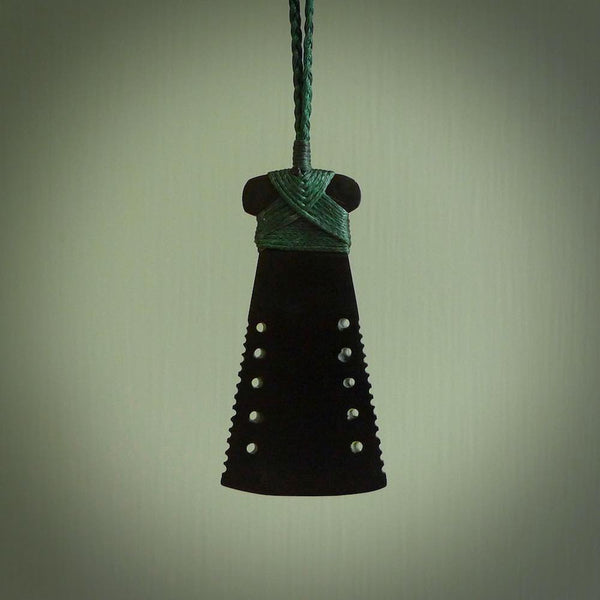 Black Jade toki pendant in all its lovely glory. We've used a lovely piece of Australian Black Jade for this traditional toki pendant. The sides are notched and we've bound it with a hand plaited cord in the traditional style. On sale by NZ Pacific with free delivery worldwide.