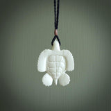 Hand carved white onyx turtle pendant. Unique handmade jewellery for sale online. Carved by NZ Pacific - moana jewellery.