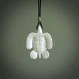 Hand carved white onyx turtle pendant. Unique handmade jewellery for sale online. Carved by NZ Pacific - moana jewellery.