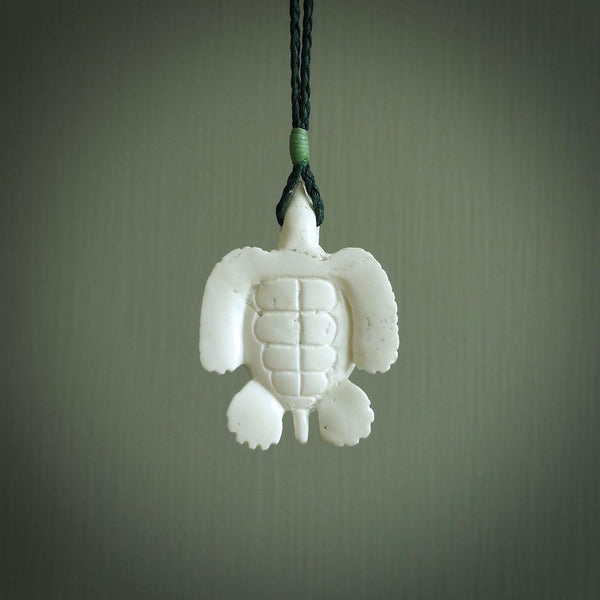 Hand carved white onyx turtle pendant. Unique handmade jewellery for sale online. Carved by NZ Pacific - moana jewellery.