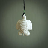 Hand carved white onyx turtle pendant. Unique handmade jewellery for sale online. Carved by NZ Pacific - moana jewellery.