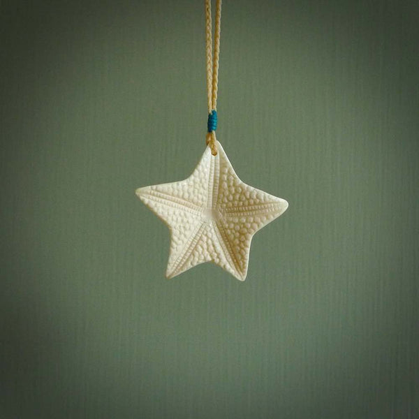 Hand carved bone starfish pendant. Ocean themed pendants carved by NZ Pacific. Moana pendants for sale online.