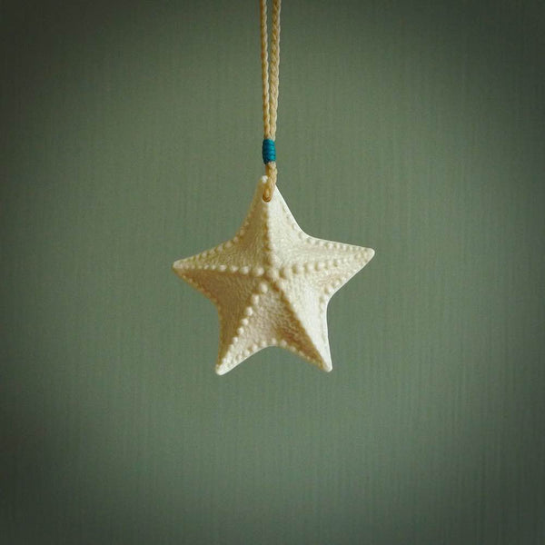 Hand carved bone starfish pendant. Ocean themed pendants carved by NZ Pacific. Moana pendants for sale online.