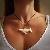Hand carved bone whale pendant. Carved by NZ Pacific in natural bone. Hand made jewellery for sale online. A beautiful whale-themed pendant - Ocean Moana.