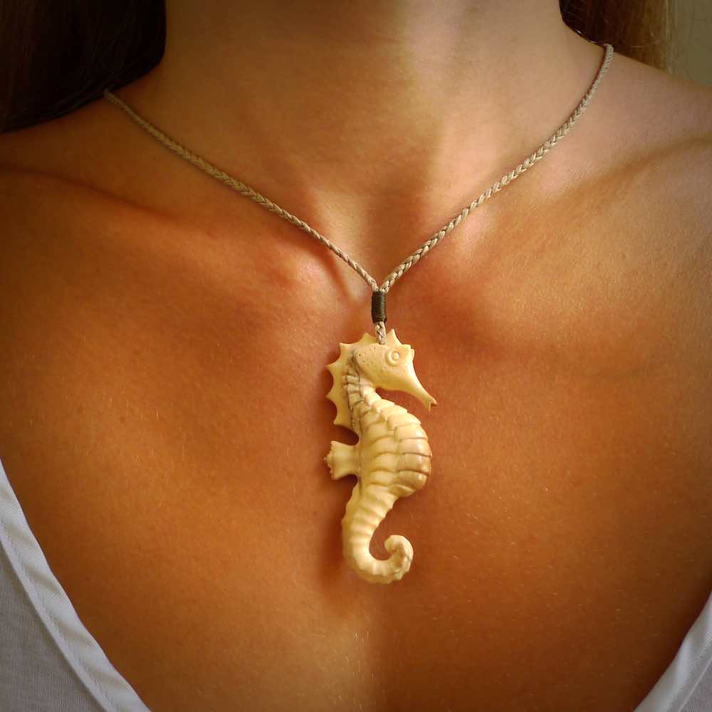 Hand carved woolly mammoth tusk seahorse pendant. Made by NZ Pacific.
