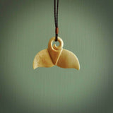 Hand carved whale tail pendant. Carved from woolly mammoth tusk in 10,000 year old mammoth tusk. A rare and original handmade pendant for ocean lovers.
