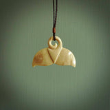 Hand carved whale tail pendant. Carved from woolly mammoth tusk in 10,000 year old mammoth tusk. A rare and original handmade pendant for ocean lovers.