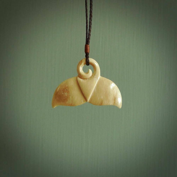 Hand carved whale tail pendant. Carved from woolly mammoth tusk in 10,000 year old mammoth tusk. A rare and original handmade pendant for ocean lovers.
