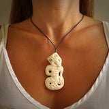 Hand carved tiki. Tiki Pendant made from cow bone by NZ Pacific. Ethnic handcarved jewellery for sale online.
