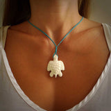 Hand carved white onyx turtle pendant. Unique handmade jewellery for sale online. Carved by NZ Pacific - moana jewellery.