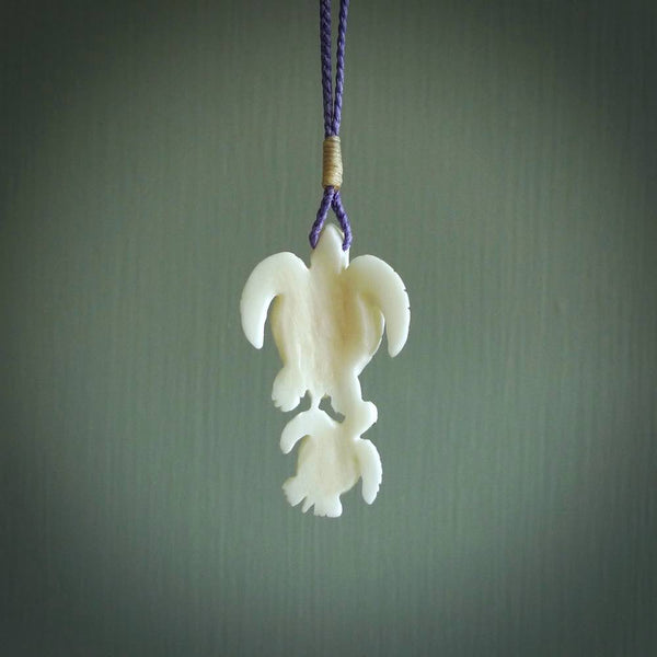 Pair of turtles hand carved in bone. Hand carved jewellery made by NZ Pacific and for sale online. Moana jewellery, handcarved in bone.