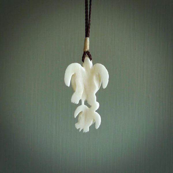 Pair of turtles hand carved in bone. Hand carved jewellery made by NZ Pacific and for sale online. Moana jewellery, handcarved in bone.