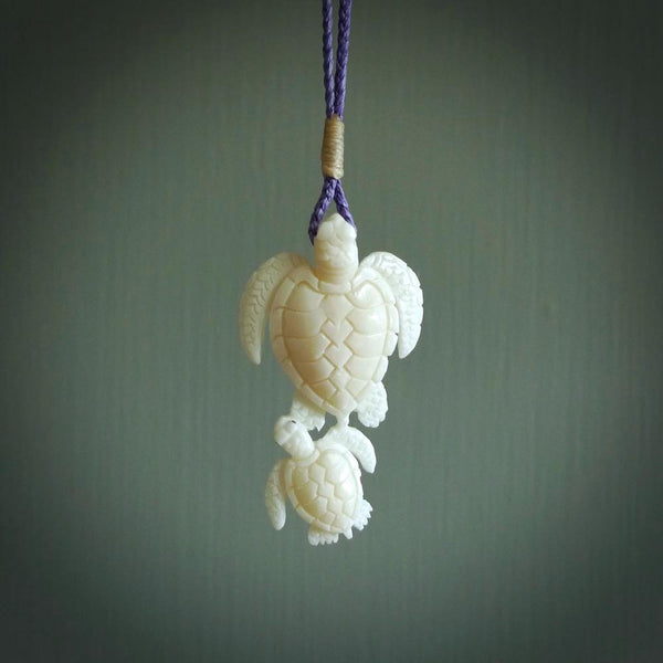 Pair of turtles hand carved in bone. Hand carved jewellery made by NZ Pacific and for sale online. Moana jewellery, handcarved in bone.