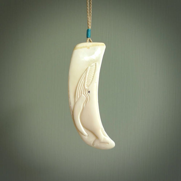 Hand carved whale pendant, carved by us. This piece is carved from boars tusk and is a fantastic depiction of these giants of the deep. This particular piece is a Blue whale design and is lovingly carved.