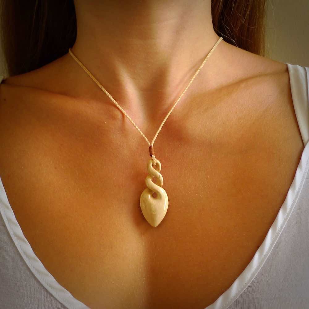 Hand carved woolly mammoth tusk twist pendant. Hand made jewellery made by NZ Pacific and for sale online. South Pacific jewellery.