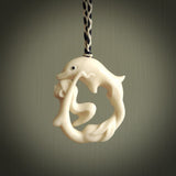 This pendant is a gorgeous and intricately carved mermaid with dolphin pendant. Carved by renowned bone carver Yuri Terenyi for us. This is a little masterpiece. It is a mermaid with her arms clasped around a dolphin. The craftsmanship displayed in this piece is extraordinary - a collectors item, or a piece to wear and love.