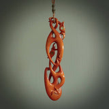 A one off beautiful piece of carved art. We have called this Twin Flame, it was hand carved for us by Yuri Terenyi and is a double manaia pendant. This is a wonderful ethnic bone pendant designed to be worn. It has been stained by a homemade tea dye in a bright gingery brown colour and we have hand plaited an adjustable cord in Khaki and gingernut brown colours..