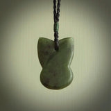 Hand carved New Zealand Jade Pounamu Wheku face pendant. Carved from New Zealand Jade by NZ Pacific. Hand crafted Jade jewellery for sale online. Pacific carving pendant, striking and unique delivered to you with Express Courier at no extra cost.