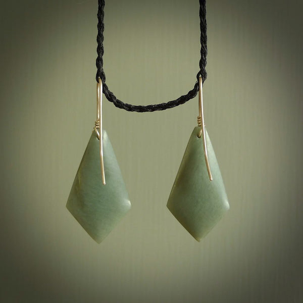 These are stunning art deco drop shaped jade earrings carved in New Zealand by Josey Coyle. They are carved from a light minty green piece of New Zealand Arahura Inanga Jade and with Sterling Silver hook and findings.