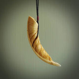 Hand made cow bone feather leaf necklace. Real boars tusk bone stained with homemade dye. Free worldwide delivery. Cool gifts from NZ Pacific. Feather pendant. Delivered with DHL Express Courier. 