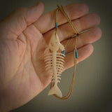 Hand carved bone fish skeleton pendant. Hand made bone fish necklace. Fish themed jewellery. Ocean themed pendant. One only necklace provided with adjustable cord and free delivery.