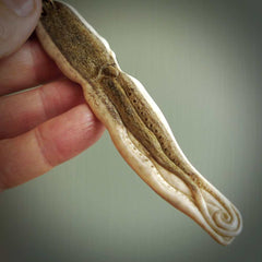 Hand carved octopus pendant. This piece has been carved in minute detail from deer antler. The artist is Fumio Noguchi, a renowned New Zealand bone carver who carves pieces for NZ Pacific. These unique bone pendants are for sale online at nzpacific.com One only collectors item for lovers of the ocean and octopus.