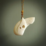 Hand carved huia bird made from cow&nbsp;bone pendant. Carved for NZ Pacific by Fumio Noguchi. This is a contemporary piece of jewellery that is carved with intricate detail and clearly shows a beautiful bird. We ship this free worldwide.