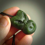 Hand carved New Zealand Jade Pounamu Wheku face pendant. Carved from New Zealand Jade by NZ Pacific. Hand crafted Jade jewellery for sale online. Pacific carving pendant, striking and unique delivered to you with Express Courier at no extra cost.