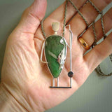 This is a very cool and creative fisherman hand made from New Zealand Jade and Sterling Silver. A fisherman who had caught a fish pendant hand crafted from sterling silver with Jade torso. A spectacular piece of art to wear.