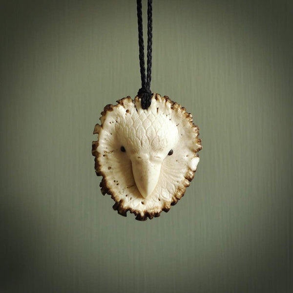 A hand carved Kakapo pendant made from a piece of deer antler crown. This is a work of art carved by Fumio Noguchi who is renowned for his skill in bone carving. The kakapo is a flightless parrot native to New Zealand and is at risk of becoming extinct. This is a great piece representing this very rare bird.