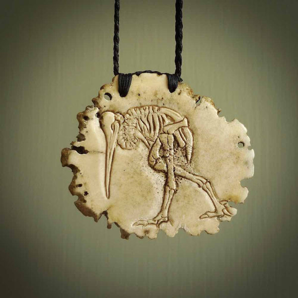 A hand carved kiwi skeleton pendant carved from a piece of deer antler crown. This is a work of art carved by Fumio Noguchi who is renowned for his skill in bone carving. The kiwi is a native bird to New Zealand. This is a great piece representing this very cool bird.