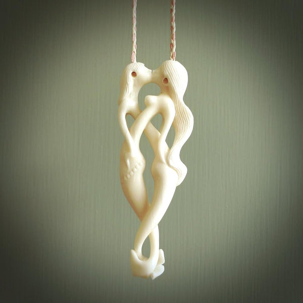 This pendant is a gorgeous and intricately carved mermaid and merman pendant. Carved by renowned bone carver Yuri Terenyi for us, this is a little masterpiece. The craftsmanship displayed in this piece is extraordinary - a collectors item, or a piece to wear and love.