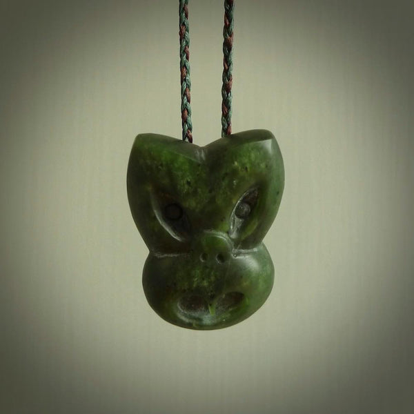 Hand carved New Zealand Jade Pounamu Wheku face pendant. Carved from New Zealand Jade by NZ Pacific. Hand crafted Jade jewellery for sale online. Pacific carving pendant, striking and unique delivered to you with Express Courier at no extra cost.