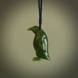 This pendant is a hand carved EMPEROR penguin. We've carved this from a lovely piece of green jade and we provide it with a hand plaited cord. Shipping is free worldwide.