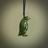 This pendant is a hand carved EMPEROR penguin. We've carved this from a lovely piece of green jade and we provide it with a hand plaited cord. Shipping is free worldwide.