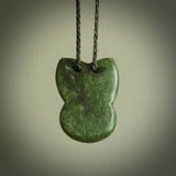 Hand carved New Zealand Jade Pounamu Wheku face pendant. Carved from New Zealand Jade by NZ Pacific. Hand crafted Jade jewellery for sale online. Pacific carving pendant, striking and unique delivered to you with Express Courier at no extra cost.