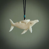 Hand carved bone whale pendant. Carved by NZ Pacific in natural bone. Hand made jewellery for sale online. A beautiful whale-themed pendant - Ocean Moana.