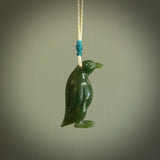 This pendant is a hand carved EMPEROR penguin. We've carved this from a lovely piece of green jade and we provide it with a hand plaited cord. Shipping is free worldwide.