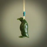 This pendant is a hand carved EMPEROR penguin. We've carved this from a lovely piece of green jade and we provide it with a hand plaited cord. Shipping is free worldwide.
