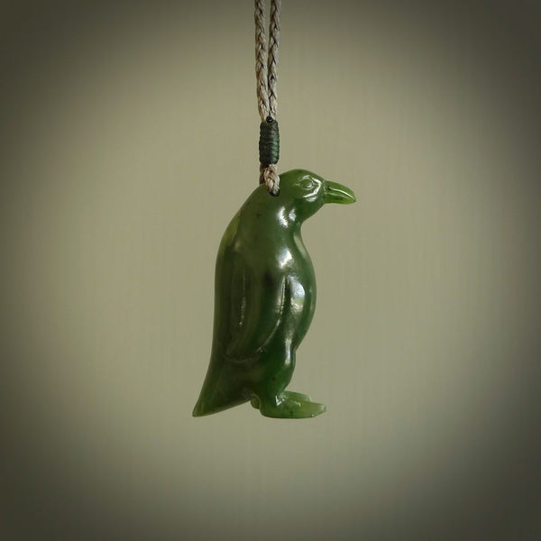 This pendant is a hand carved EMPEROR penguin. We've carved this from a lovely piece of green jade and we provide it with a hand plaited cord. Shipping is free worldwide.