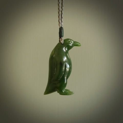 This pendant is a hand carved EMPEROR penguin. We've carved this from a lovely piece of green jade and we provide it with a hand plaited cord. Shipping is free worldwide.