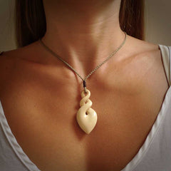 Hand carved woolly mammoth ivory twist pendant. Made by NZ Pacific.