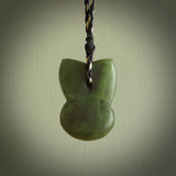 Hand carved New Zealand Jade Pounamu Wheku face pendant. Carved from New Zealand Jade by NZ Pacific. Hand crafted Jade jewellery for sale online. Pacific carving pendant, striking and unique delivered to you with Express Courier at no extra cost.